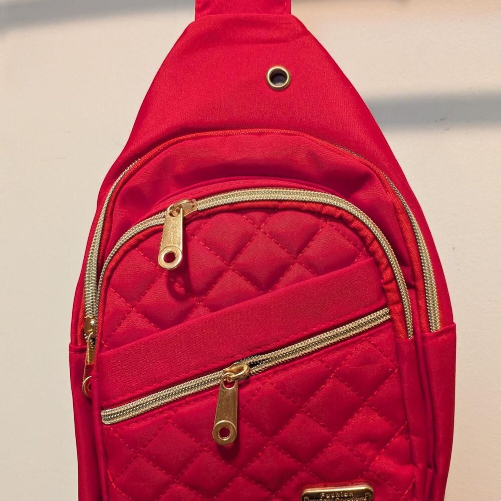 Red quilted crossbody bag with gold hardware